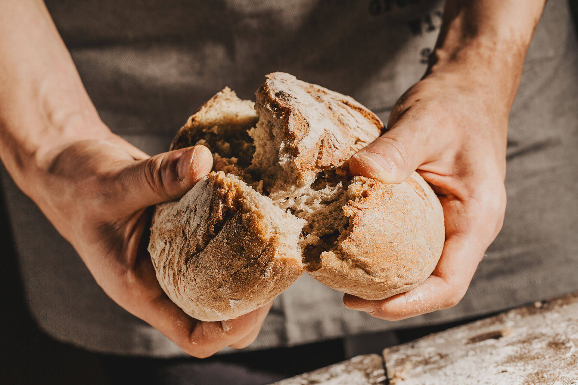 baker-or-chef-holding-fresh-made-bread-2WRSQ8J.jpg